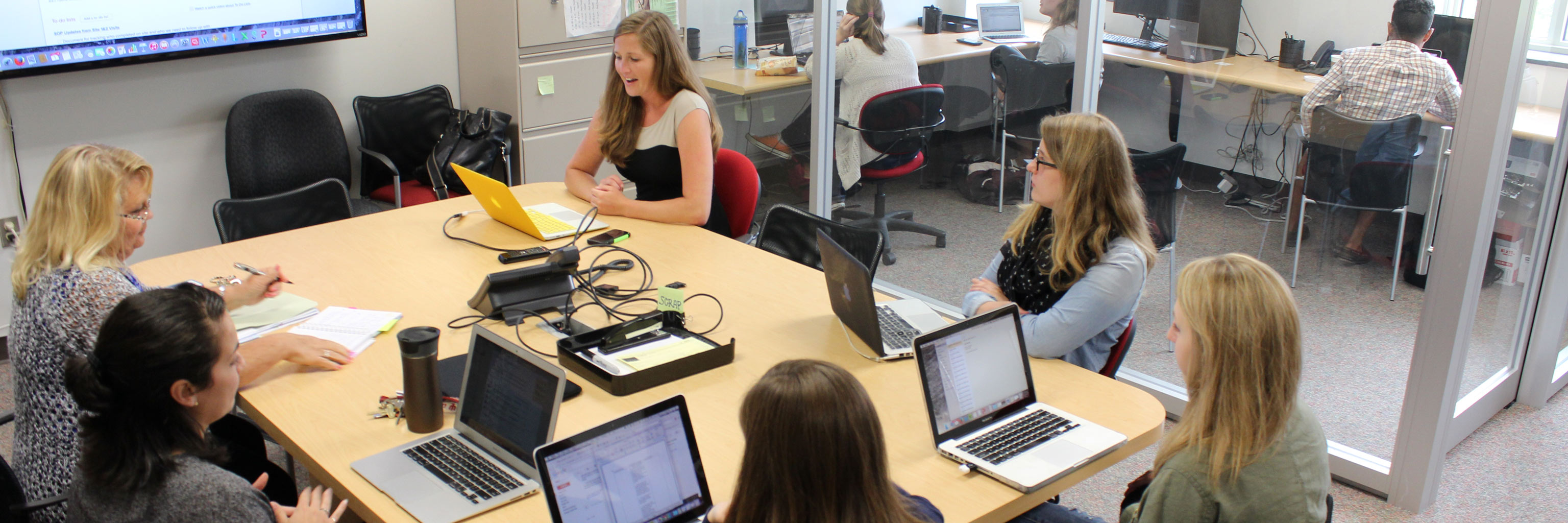 women sitting around a conference table