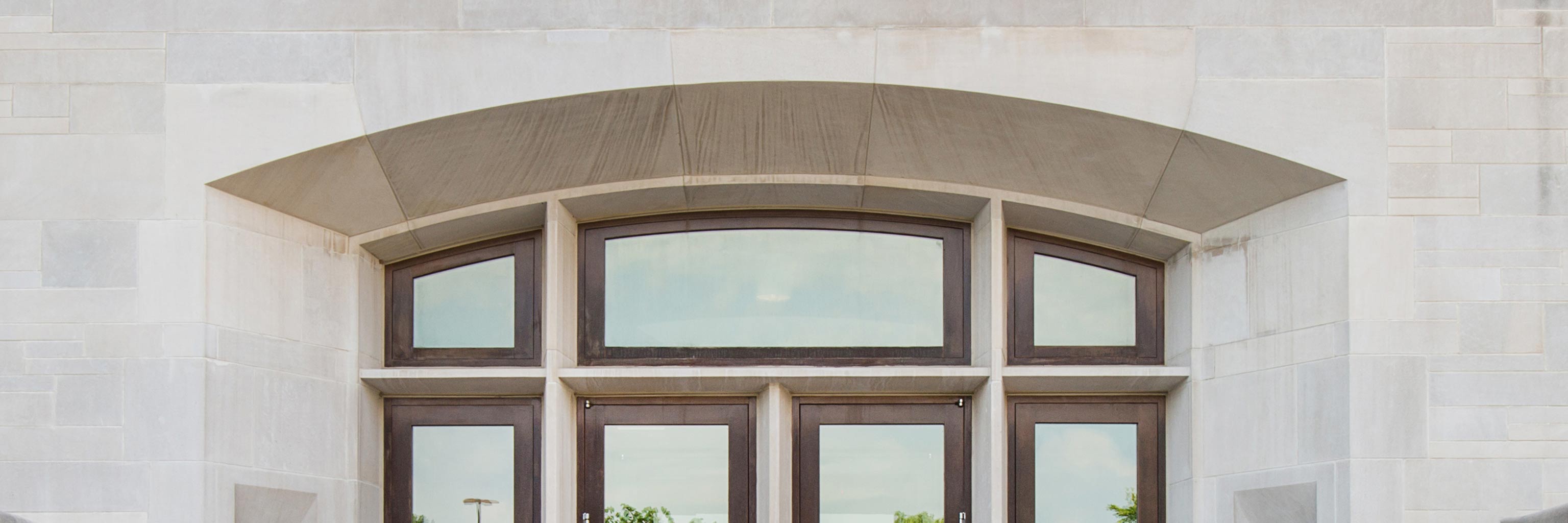 limestone building wall with windows