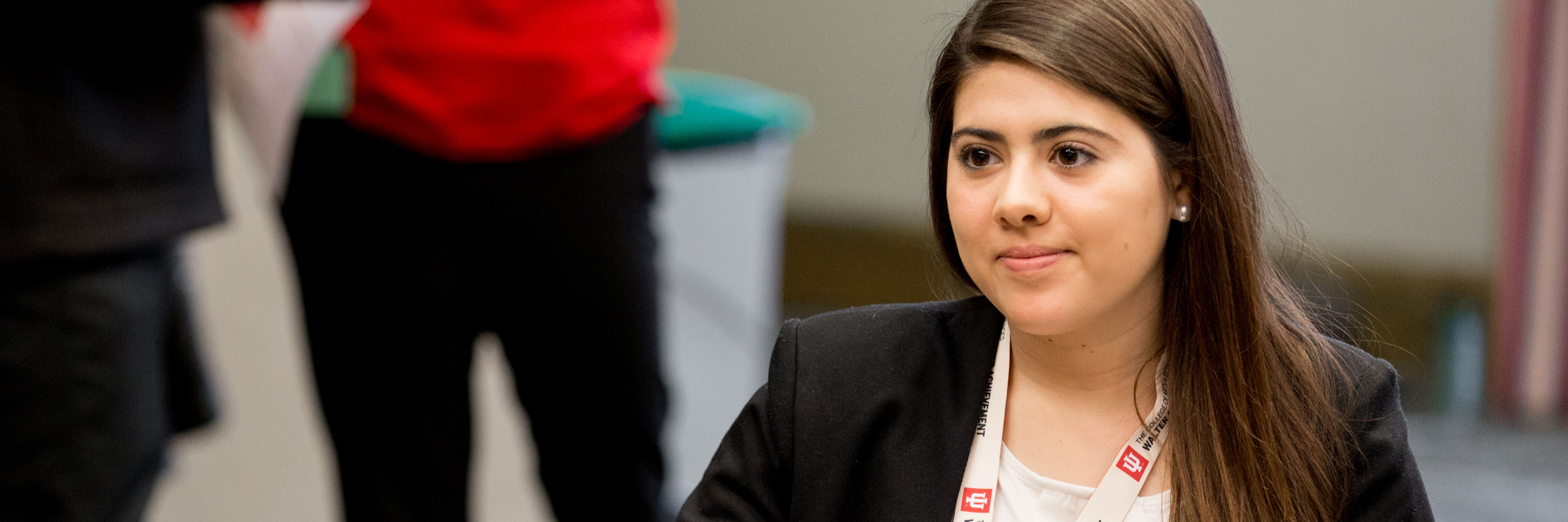 woman in a business suit looking to the left